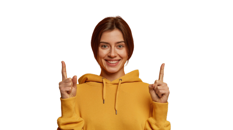 friendly looking lovely woman shows promo with joy points with both index fingers gives recommendation advice wears yellow hoodie